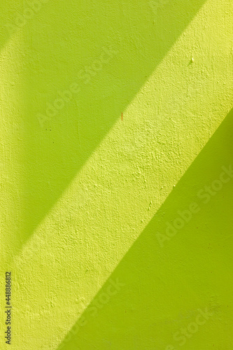 Cemented wall with sun rays on the wall