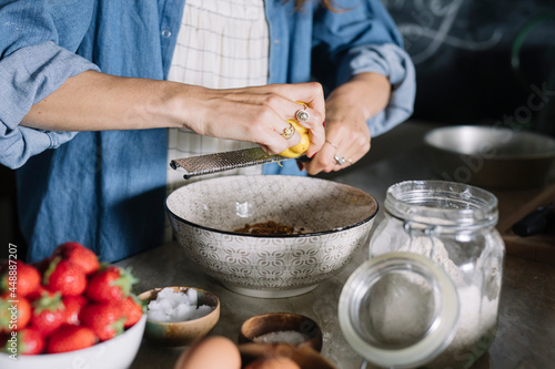 Anonymous Woman Making Strawberry And Lemon Pie 