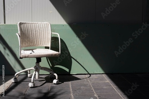 an old chair abandoned in a urban street