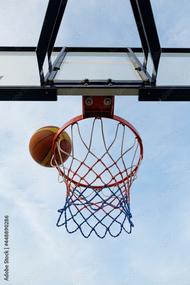 Basketball ball falling into hoop Basketball ball falling into hoop