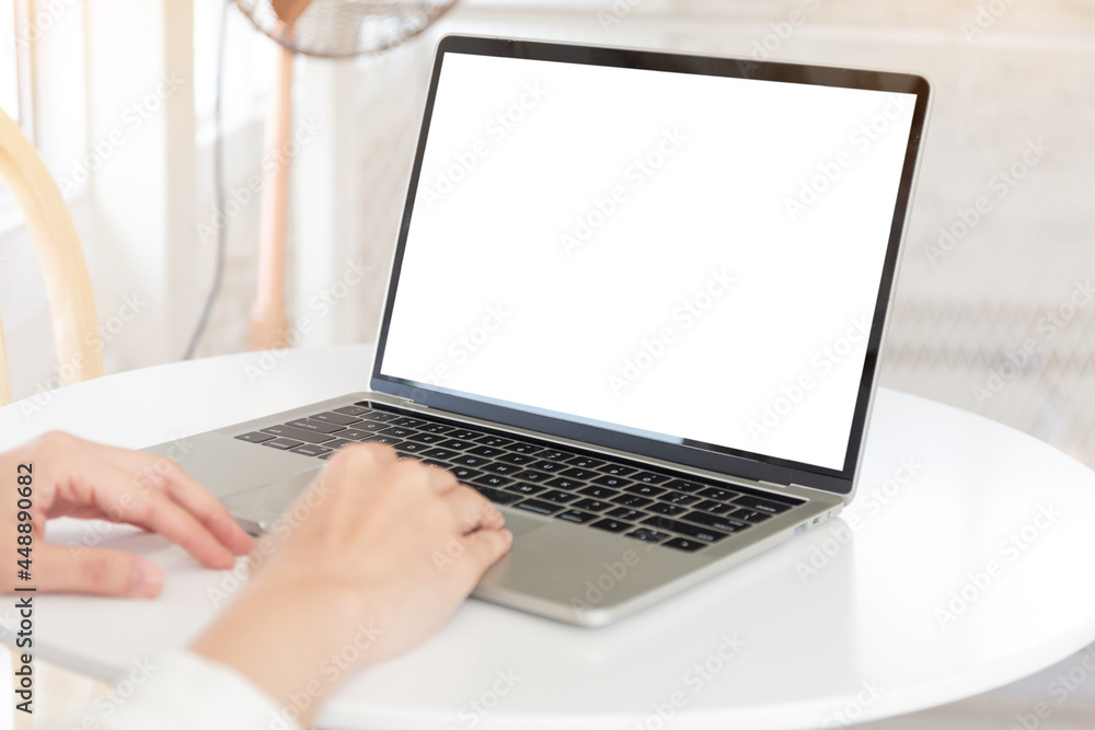 computer screen blank mockup.hand woman work using laptop with white background for advertising,contact business search information on desk at coffee shop.marketing and creative design computer screen blank mockup.hand woman work using laptop with white background for advertising,contact business search information on desk at coffee shop.marketing and creative design