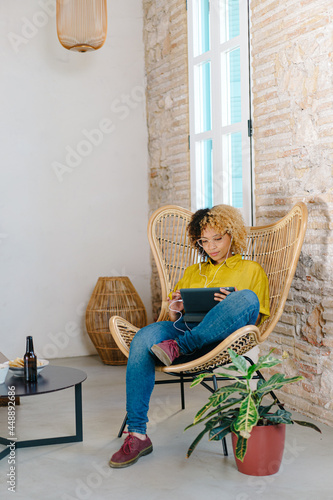 Young woman watching movie on tablet photo