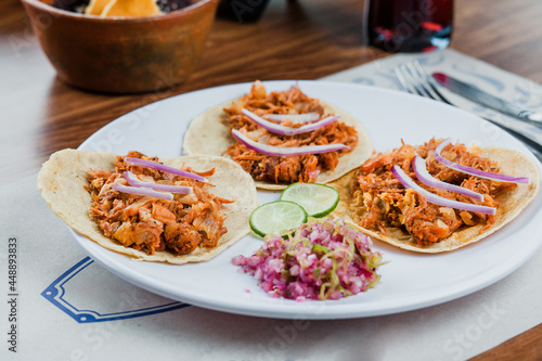 Mexican tacos with cochinita pibil, onion and lemon, traditional mexican food in Mexico City