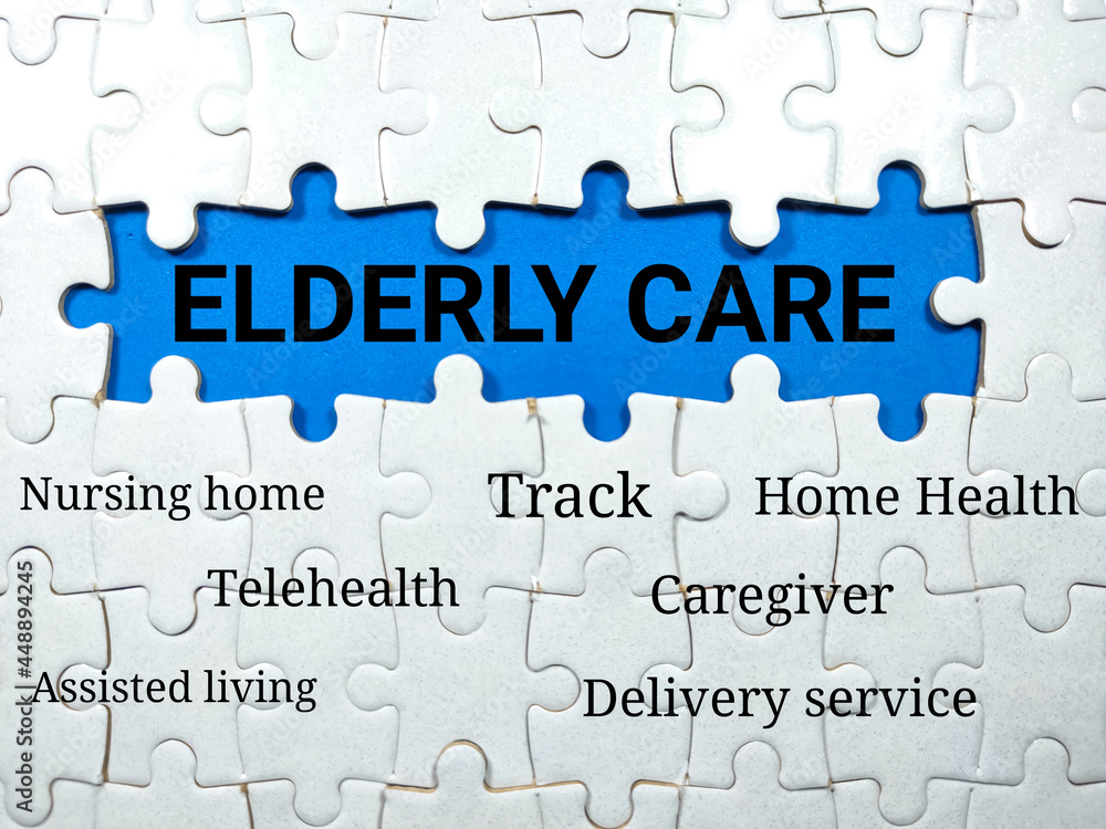 Text ELDERLY CARE writing on blue background with jigsaw puzzle.Elderly care concept. Text ELDERLY CARE writing on blue background with jigsaw puzzle.Elderly care concept.