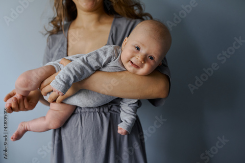 portrait of a newborn on  background in the hands  photo