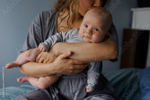 portrait of a newborn on  background in the hands 