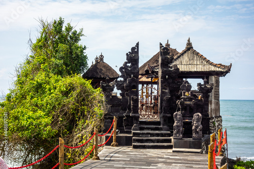 Sculptures on Tanah Lot, a rock formation in Bali photo