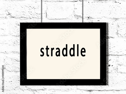 Принти на полотні Black frame hanging on white brick wall with inscription straddle