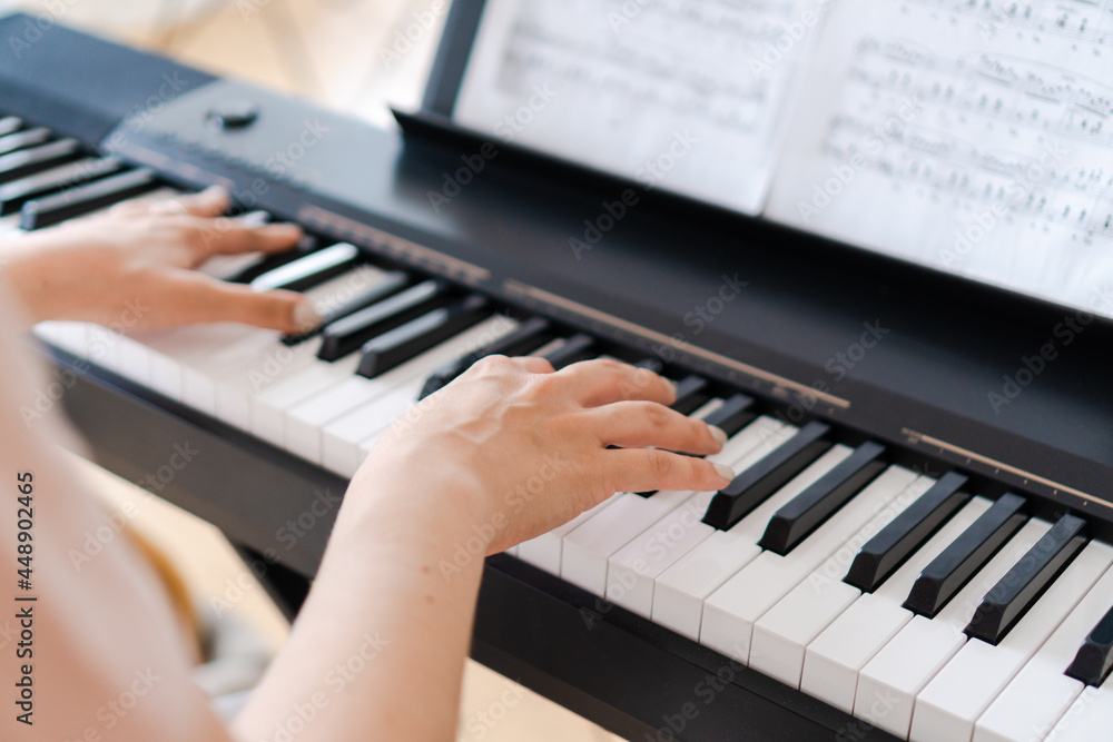 Pianist hands on musical keyboard Pianist hands on musical keyboard