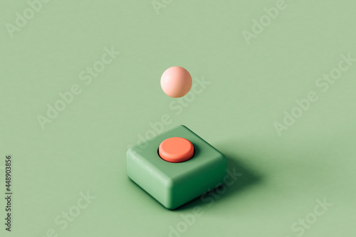 green and pink button with a pink sphere