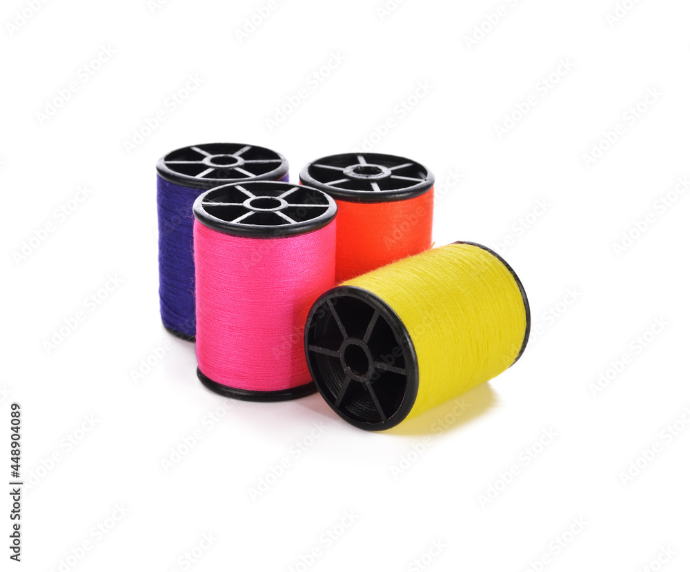 Colourful thread spools isolated on a white background. Colourful thread spools isolated on a white background.