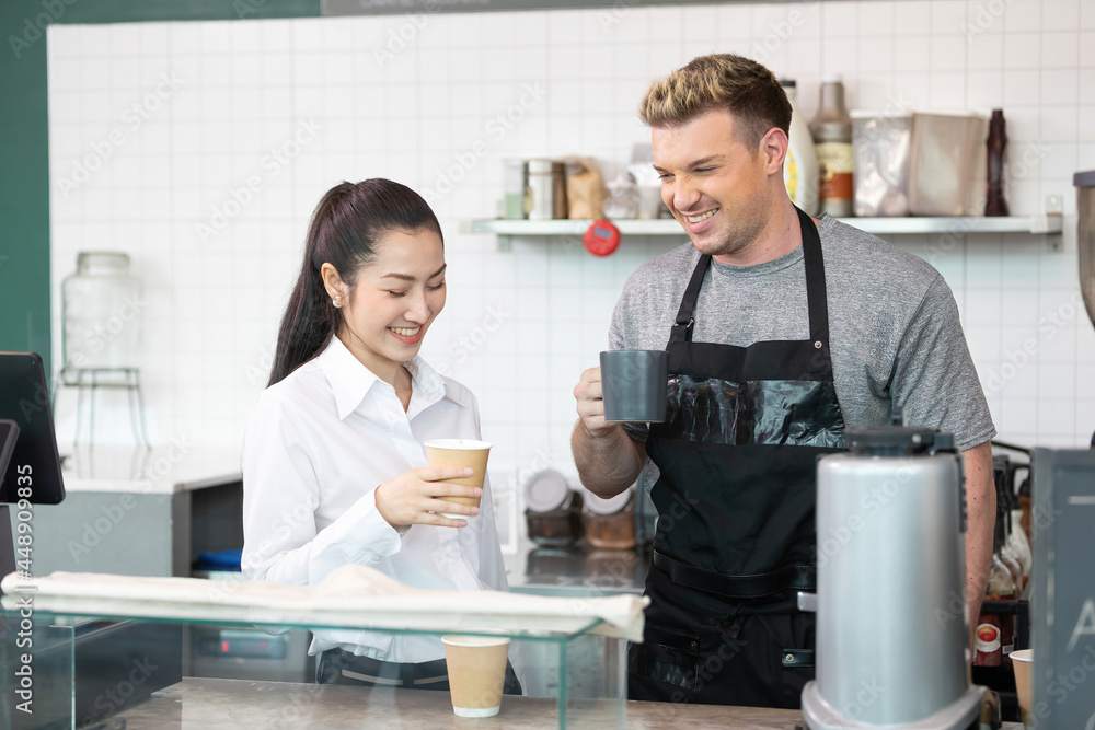 barista and owner tasting a cup of coffee before opening in coffee shop barista and owner tasting a cup of coffee before opening in coffee shop