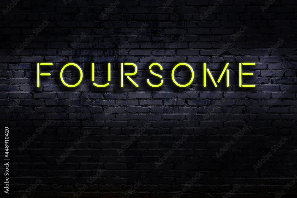 Ταπετσαρία Neon sign. Word foursome against brick wall. Night view