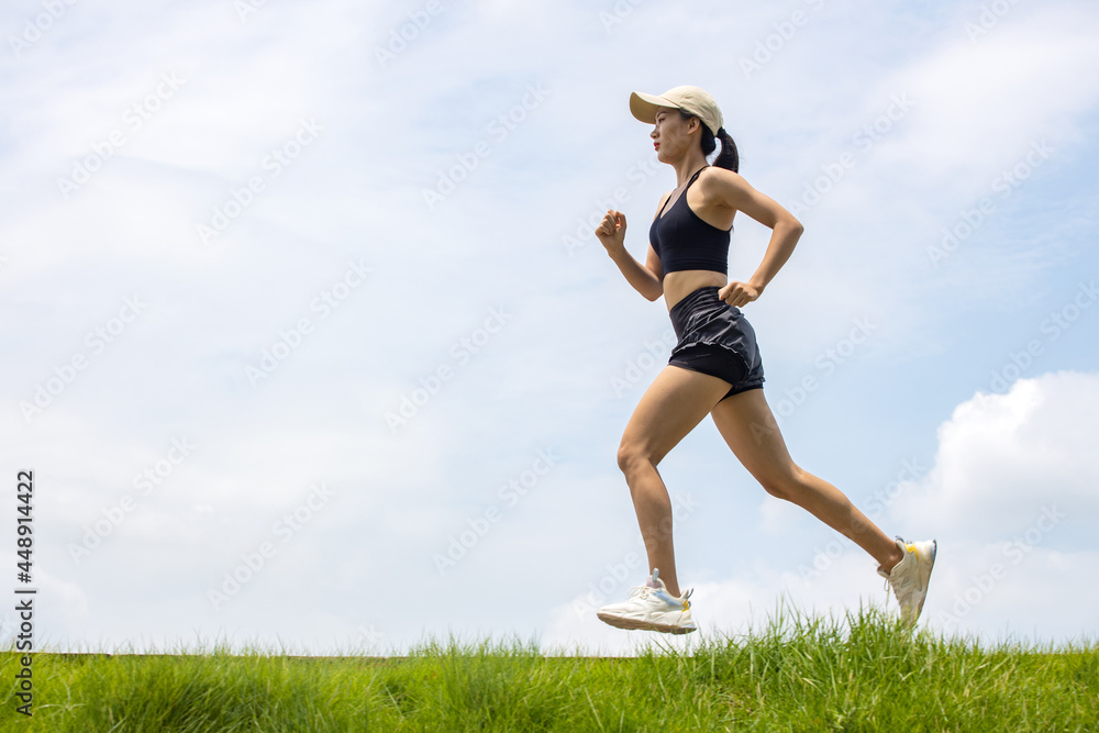 Young Asian girls running in the morning for fitness Young Asian girls running in the morning for fitness