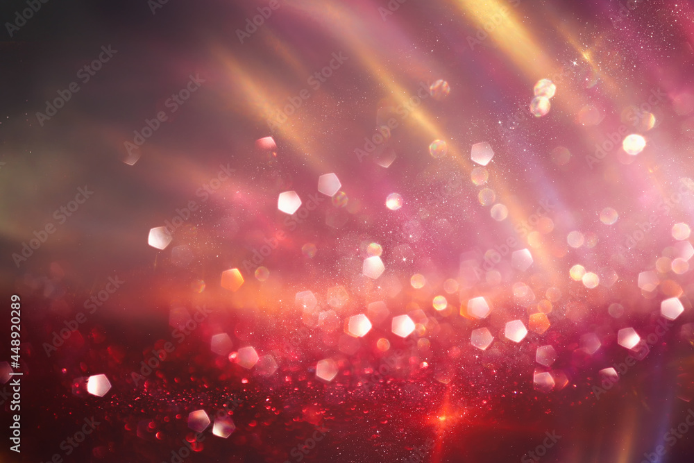 Obraz premium background of abstract red, gold and black glitter lights. defocused
