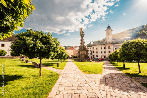 Historical town square in mining city Kremnica in Slovakia. The outlook to castle and St. Catherine church in the town. photo