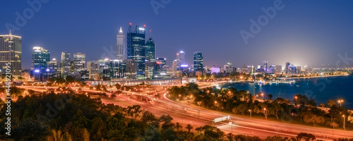 Panoramic view of Perth city buildings and the Mitchell Freeway viewed at night from Kings Park. Perth is a modern and vibrant city and is the state capital of Western Australia  Australia.