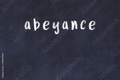 Black chalkboard with inscription abeyance on in