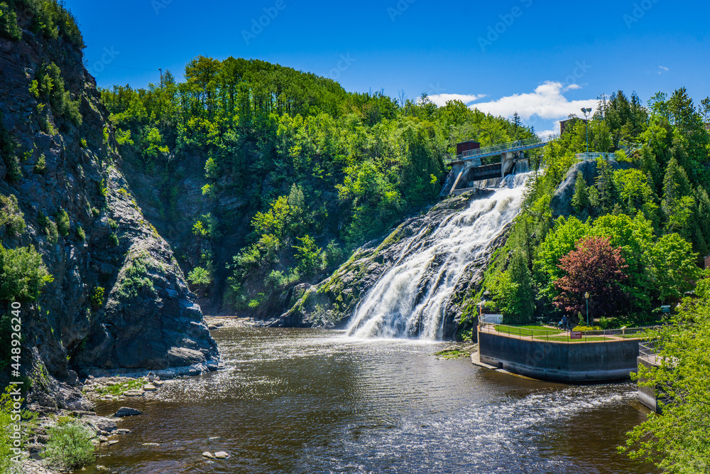 Fototapeta premium Riviere du Loup waterfall, created by an old hydroelectric powerplant in Riviere du Loup city, a small town of Bas St Laurent, region of Quebec (Canada)