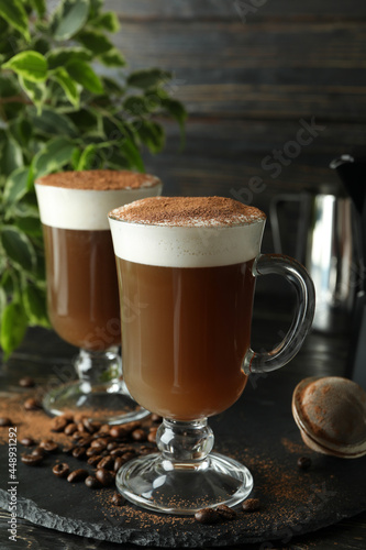 Concept of delicious drink with Irish coffee on wooden table