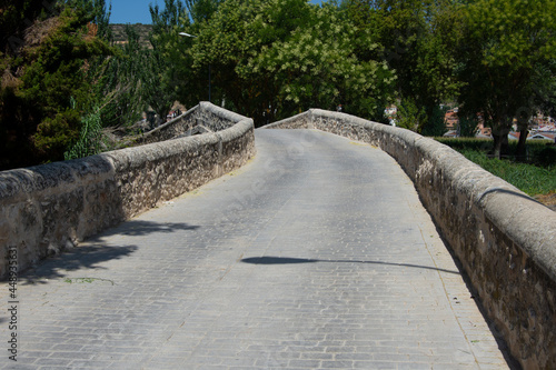 Paso del viejo puente de piedra sobre el río Tajuña en Tielmes, Madrid photo