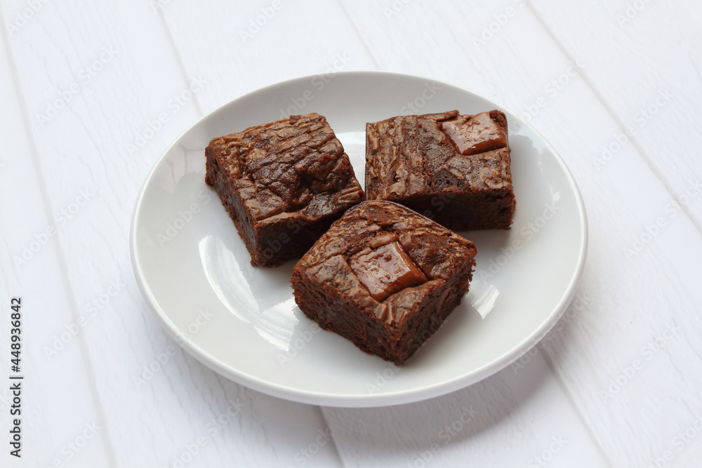 Homemade brownies with milk chocolate chunks on top Homemade brownies with milk chocolate chunks on top