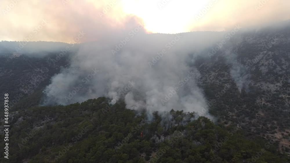 Summer forest fires. Smoke of a forest fire obscures the sun. Natural disasters. Bogsak, Mersin province, Turkey. Aerial view Summer forest fires. Smoke of a forest fire obscures the sun. Natural disasters. Bogsak, Mersin province, Turkey. Aerial view