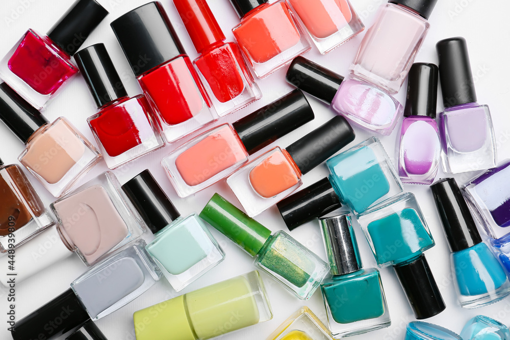 Obraz premium Different nail polishes on white background