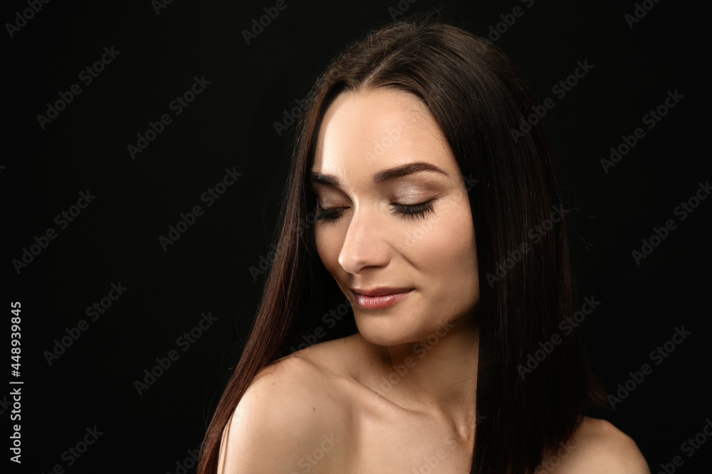 Portrait of pretty young woman with gorgeous chestnut hair on black background Portrait of pretty young woman with gorgeous chestnut hair on black background