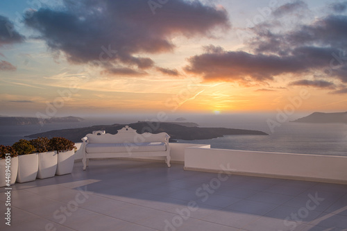 Wedding decoration on Santorini Island, a popular wedding destination in Greece. Elegant wedding with sunset view, colorful sky clouds background of ocean and blue sky. Beautiful wedding sunset