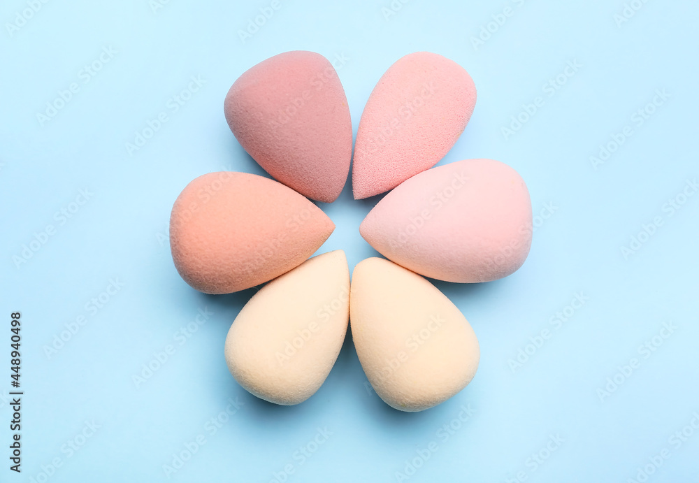 Makeup sponges on color background