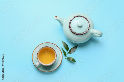 Teapot and cup of tea with ...