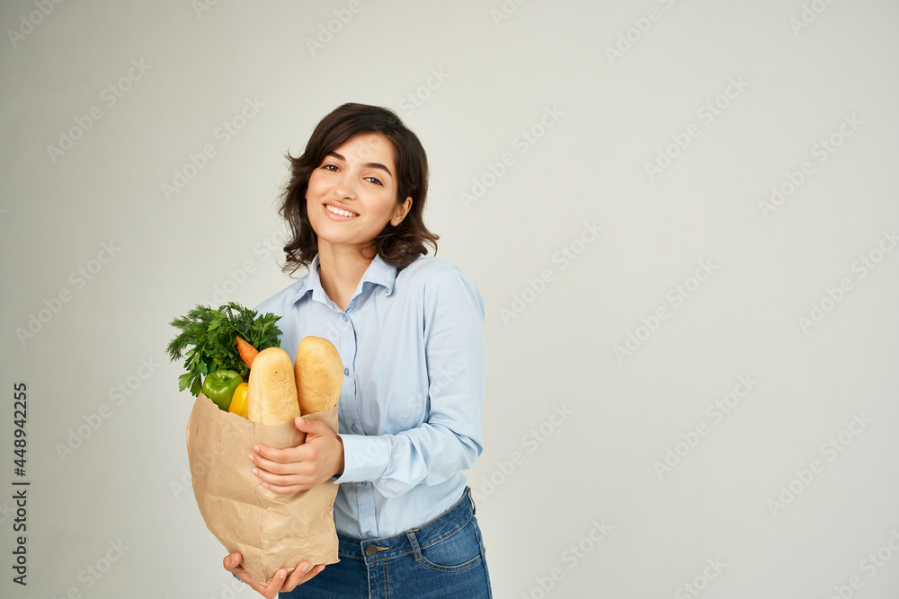 woman with a package of groceries healthy food vegetables supermarket shopping woman with a package of groceries healthy food vegetables supermarket shopping