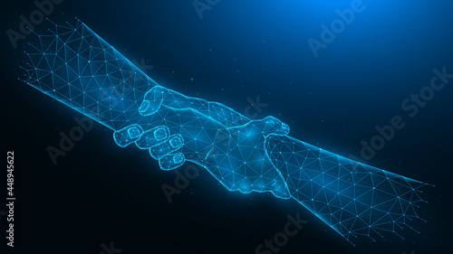 Helping hand low poly art. Polygonal vector illustration of human hands holding each other on a dark blue background. Concept of salvation. photo