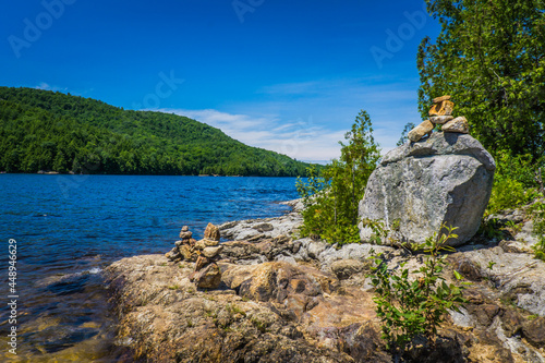 The blue waters of Lac du Poisson Blanc (Whitefish lake), in the eponym regional park. A park with typical landscape of the province of Quebec (Canada) photo