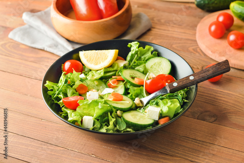 Fresh green salad with cher...
