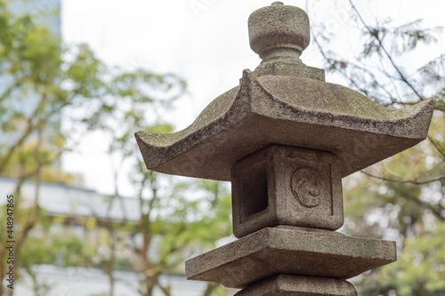 stone lantern of akasaka hikawa shrine in tokyo, japan photo
