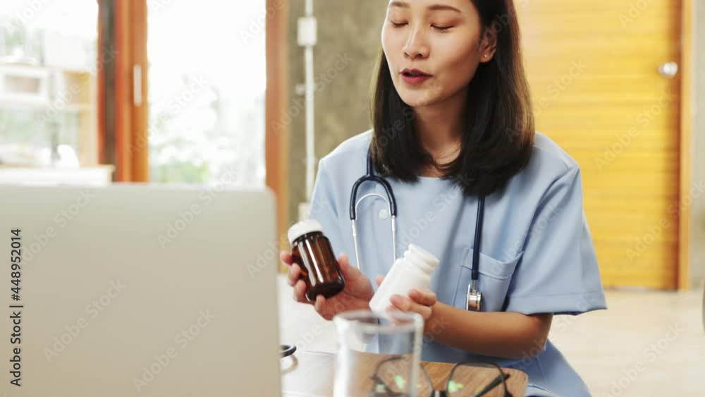 Portrait of young asian woman doctor with white coat standing in hospital.Telemedicine, Medical online, e health concept. Doctor using laptop for work.Remote medical help for distance patient advice. Portrait of young asian woman doctor with white coat standing in hospital.Telemedicine, Medical online, e health concept. Doctor using laptop for work.Remote medical help for distance patient advice.