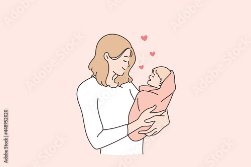 Happy motherhood and childhood concept. Young and happy mom mother woman cartoon character standing holding her baby little newborn son or daughter vector illustration