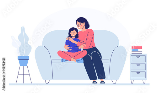 mom with the child sits on the couch, shows love, hugs the child. family relationships.