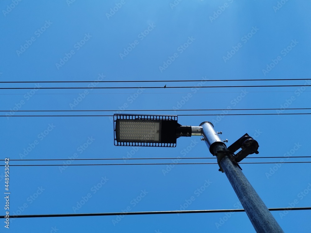 solar cell light pole and wires on beautiful sky background. solar cell light pole and wires on beautiful sky background.