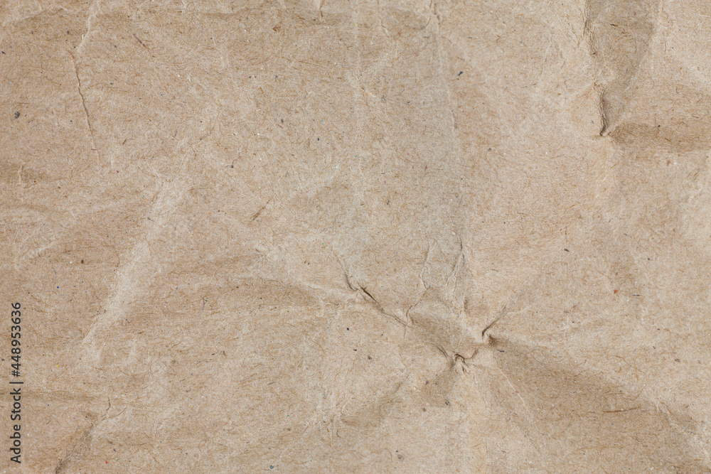 Obraz premium Textured crumpled packaging brown paper background.