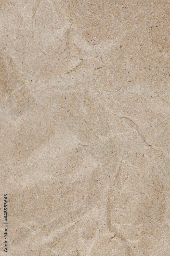 Textured crumpled packaging brown paper background. Textured crumpled packaging brown paper background.