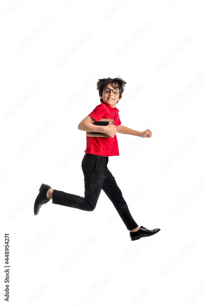 Jumping little schoolboy on white background Jumping little schoolboy on white background