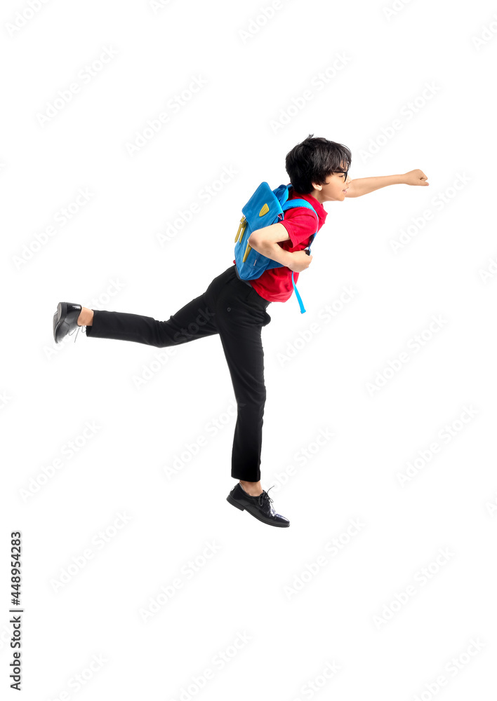 Jumping little schoolboy on white background Jumping little schoolboy on white background