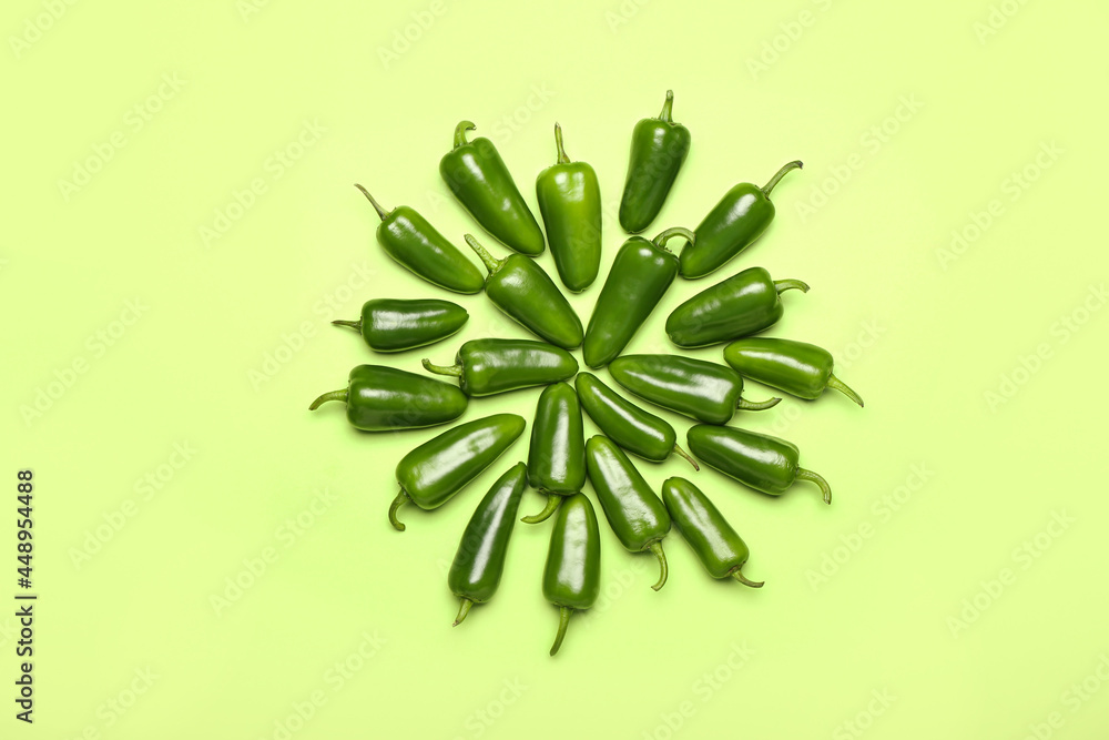 Green jalapeno peppers on color background Green jalapeno peppers on color background