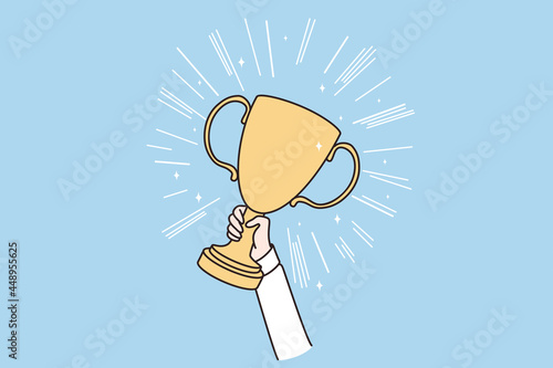Reaching goals, winner, victory concept. Hands of person holding golden trophy celebrating success vector illustration 
