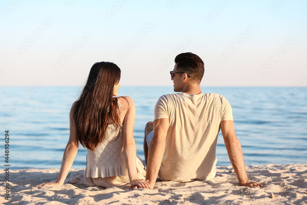 Happy young couple on sea beach Happy young couple on sea beach