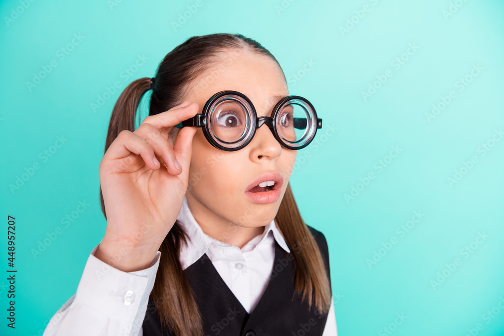 Photo portrait little girl wearing glasses amazed shocked staring isolated pastel turquoise color background