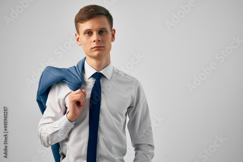 business man in shirt with tie jacket on shoulder successful manager office